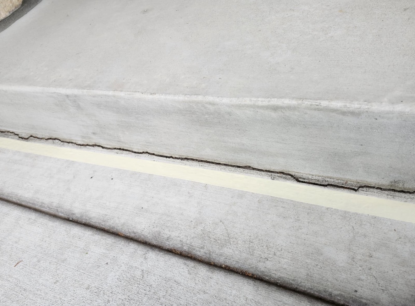 Close-up of the concrete step joint during sealant work