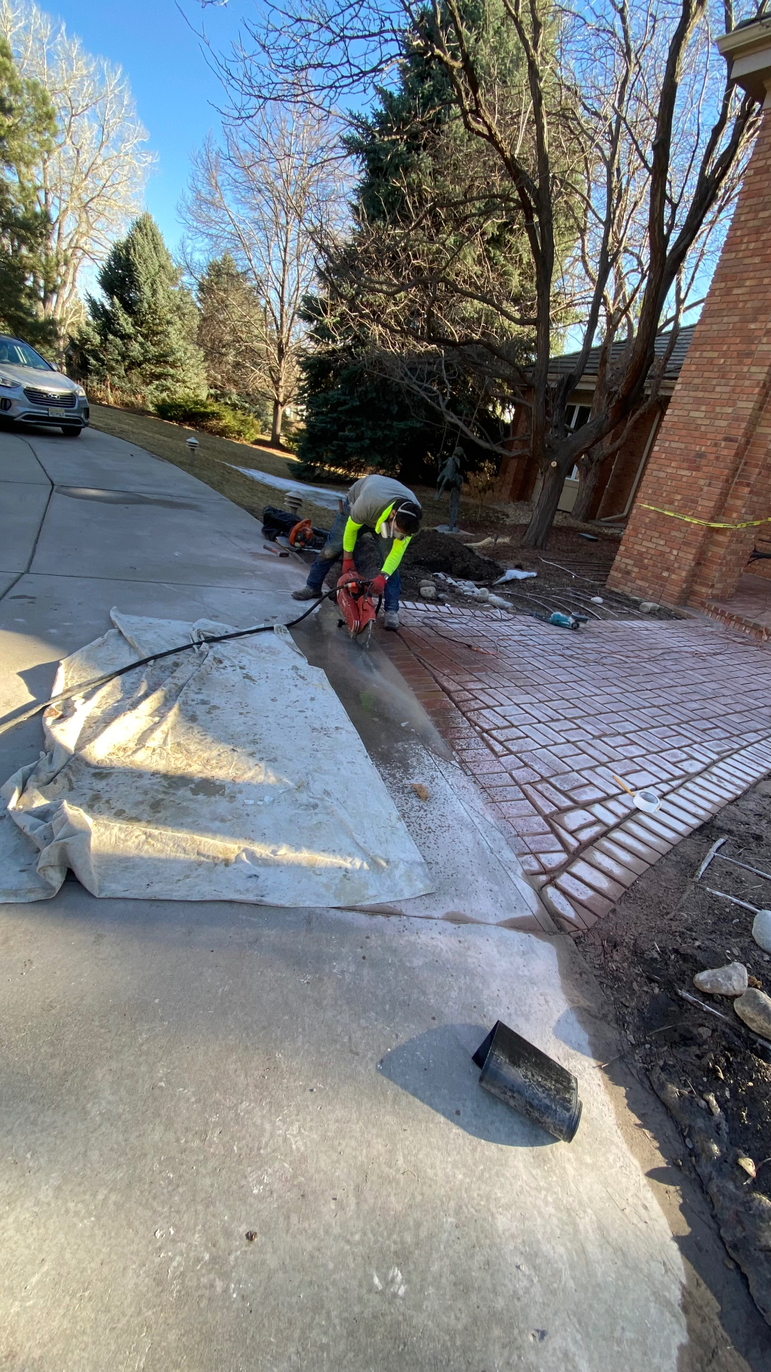 Paver cutting and installation during the Cherry Hills walkway restoration